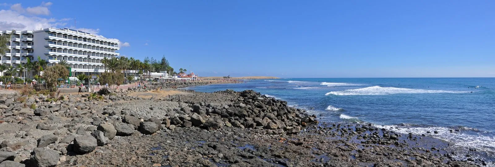 The wide golden beach at Maspalomas stretching along the south coast of Gran Canaria