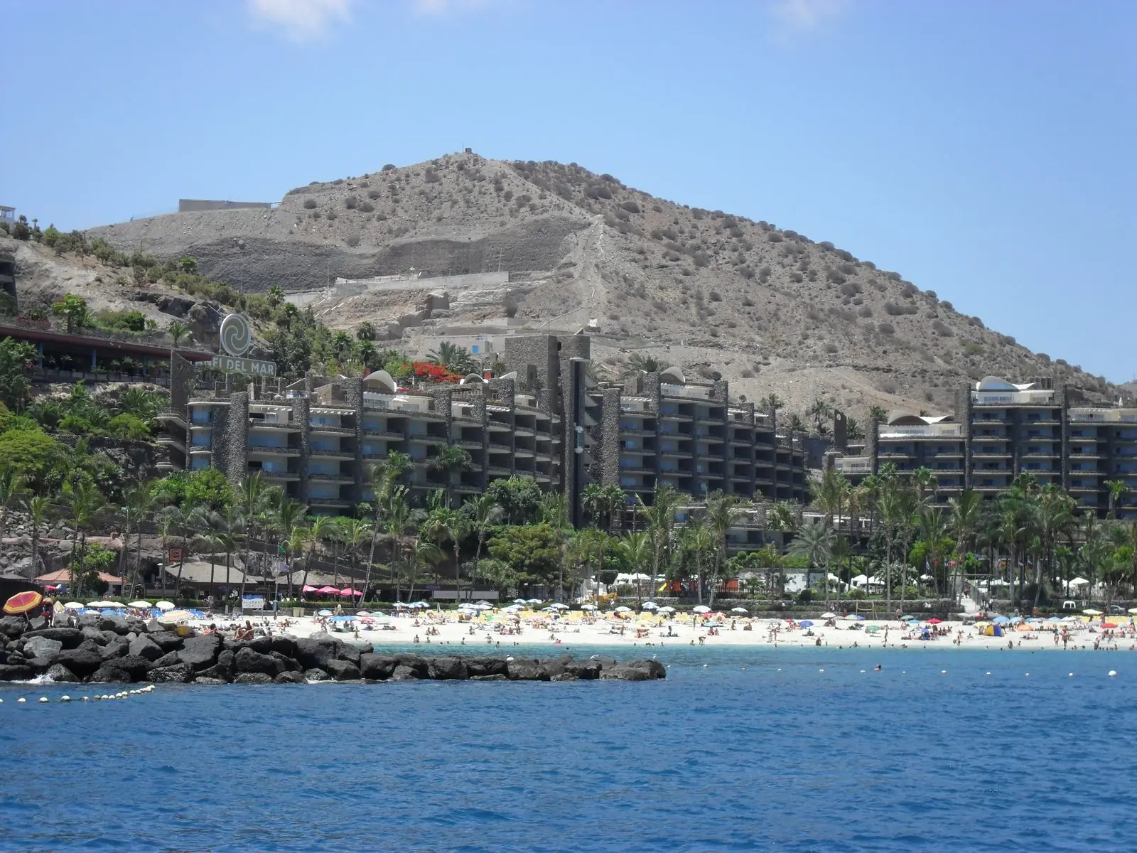 Whitewashed low-rise apartment blocks of the Anfi del Mar timeshare complex above the beach, Gran Canaria